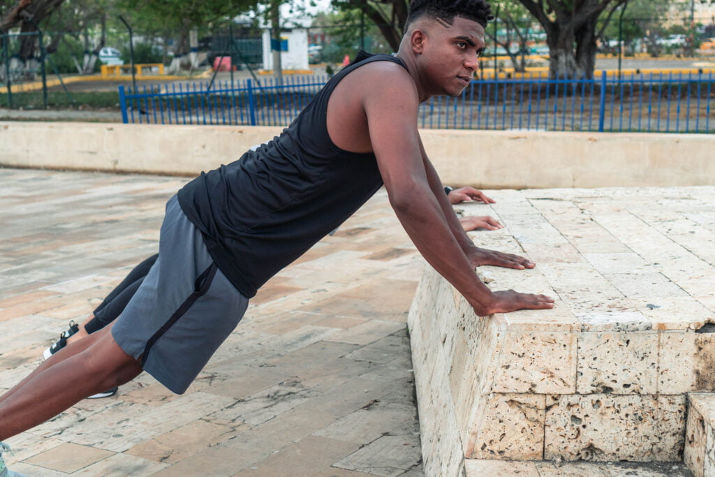 African American man exercising in city park